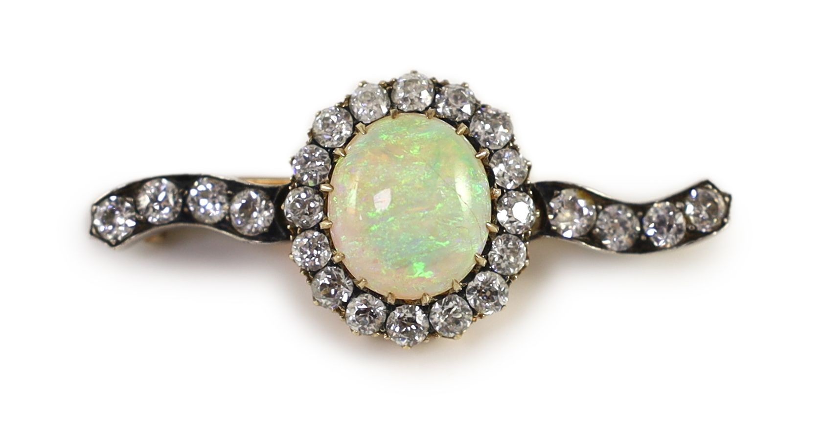 An early 20th century gold, white opal and diamond cluster set brooch